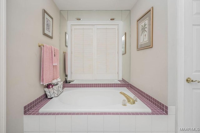 bathroom with a garden tub