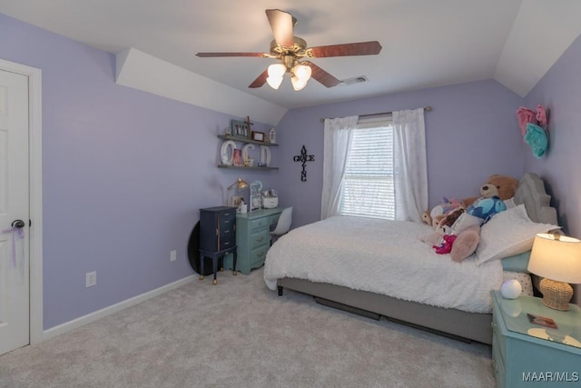 carpeted bedroom featuring vaulted ceiling, ceiling fan, visible vents, and baseboards