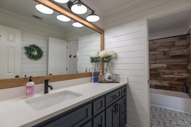 bathroom with visible vents, ornamental molding, shower / washtub combination, and vanity