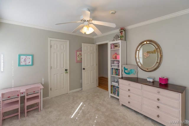 bedroom with ceiling fan, ornamental molding, baseboards, and light colored carpet