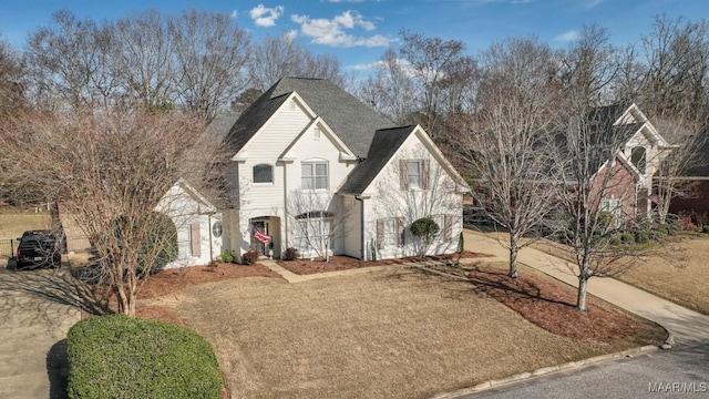 view of front of home featuring roof with shingles