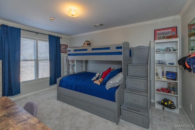 carpeted bedroom with baseboards, visible vents, and crown molding