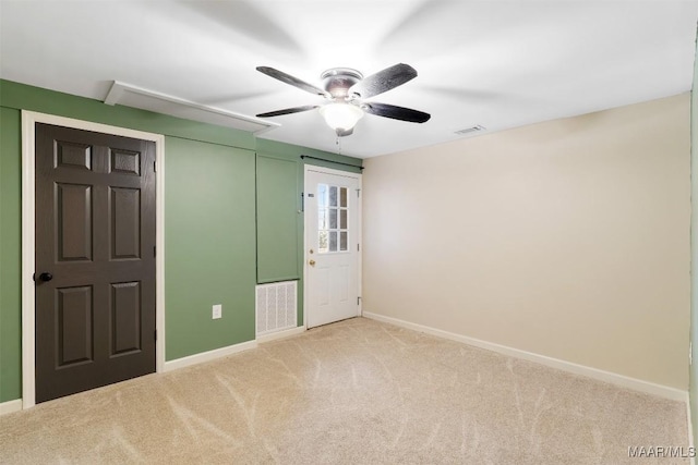 unfurnished bedroom featuring light carpet, baseboards, and visible vents