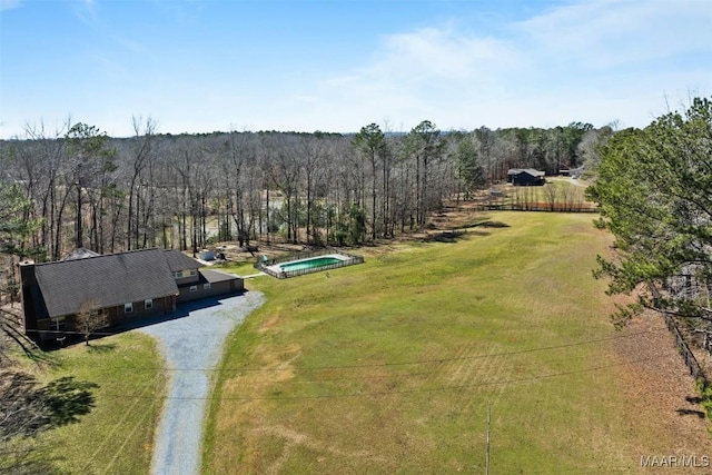 bird's eye view featuring a wooded view