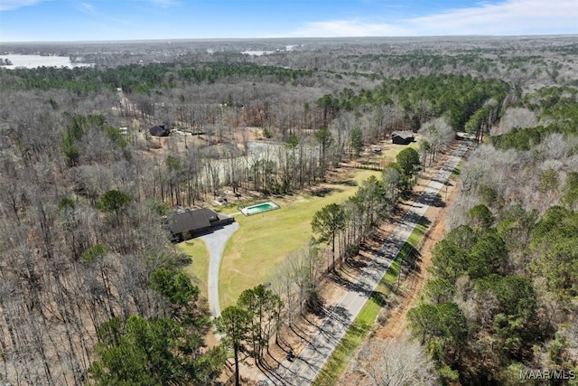 birds eye view of property with a wooded view