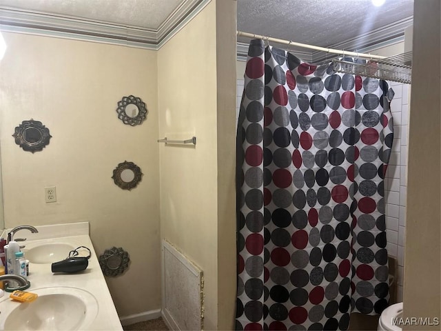 bathroom featuring a shower with curtain, crown molding, a textured ceiling, and a sink