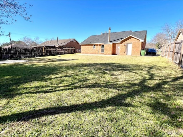 view of yard featuring a fenced backyard