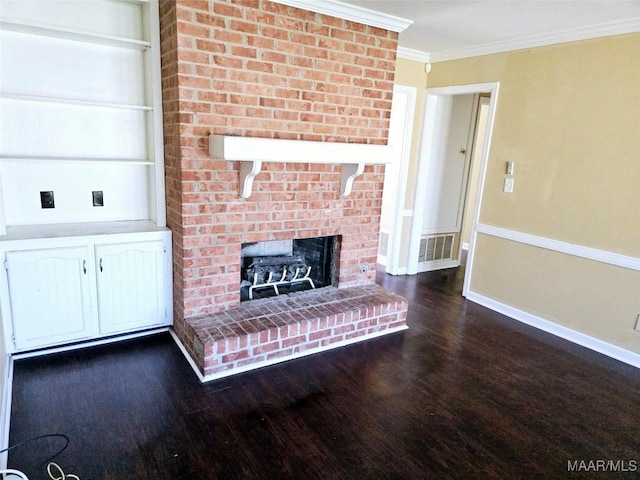 unfurnished living room featuring dark wood-style floors, a brick fireplace, visible vents, and crown molding