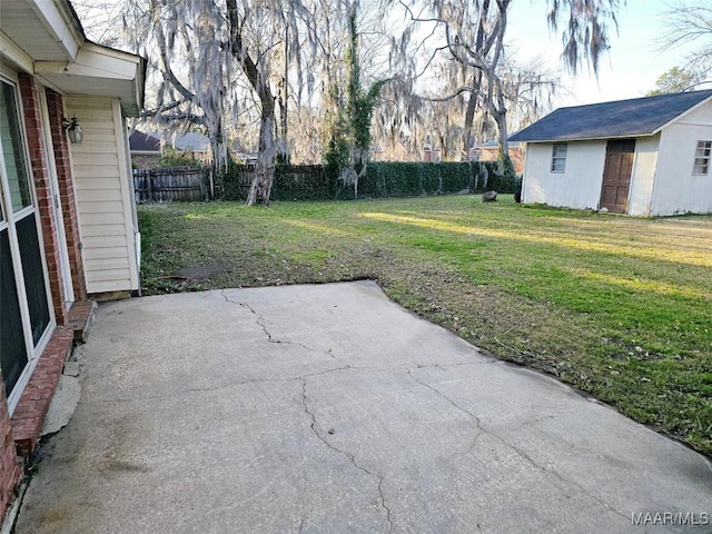 view of patio / terrace featuring an outdoor structure and fence