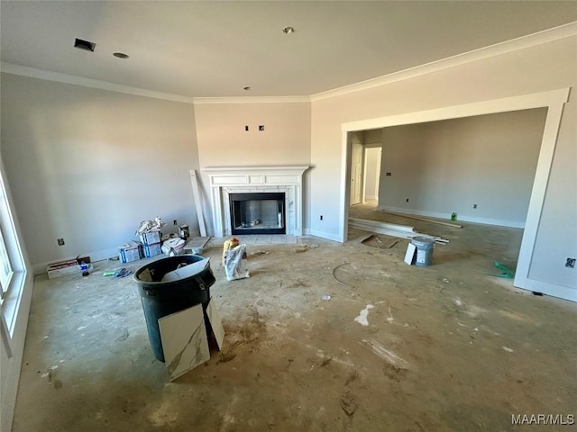 living area featuring a fireplace with raised hearth, crown molding, and baseboards