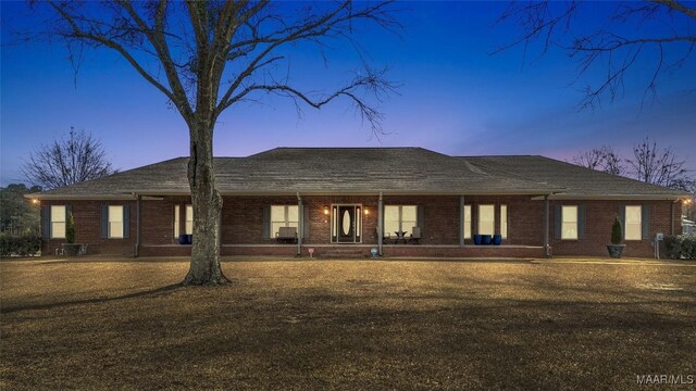 9524 County Road 42nd Rd, Jemison, AL 35085 - back of property at dusk with a porch and brick siding