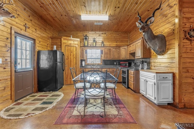 9524 County Road 42nd Rd, Jemison, AL 35085 - kitchen with wood ceiling, double oven range, freestanding refrigerator, concrete floors, and wooden walls