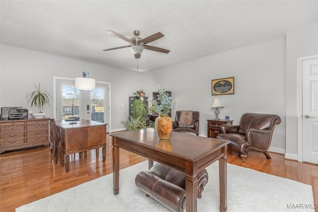 9524 County Road 42nd Rd, Jemison, AL 35085 - home office with a textured ceiling, ceiling fan, and light wood-style flooring