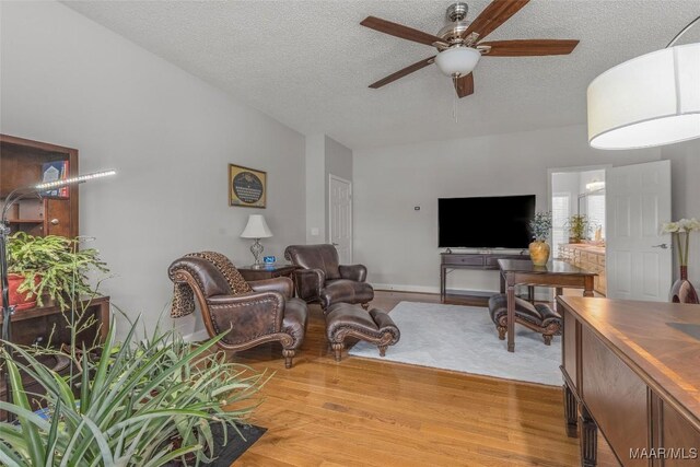 9524 County Road 42nd Rd, Jemison, AL 35085 - living area with a ceiling fan, a textured ceiling, and light wood-style floors