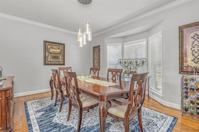 9524 County Road 42nd Rd, Jemison, AL 35085 - dining room with crown molding, a textured ceiling, baseboards, and light wood-type flooring