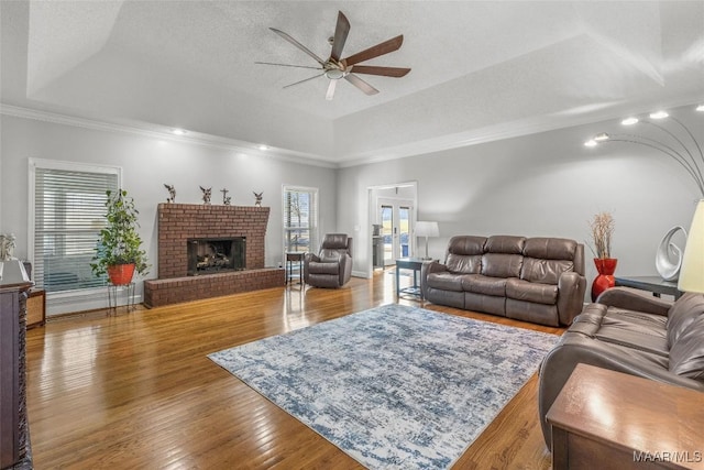 9524 County Road 42nd Rd, Jemison, AL 35085 - living room featuring ornamental molding, a fireplace, a ceiling fan, and wood finished floors