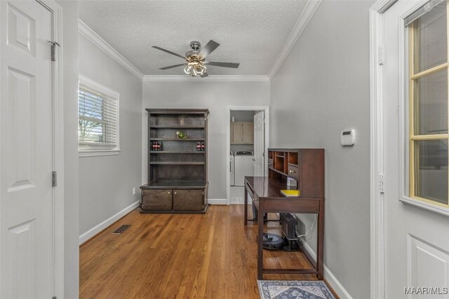 9524 County Road 42nd Rd, Jemison, AL 35085 - interior space featuring a textured ceiling, ornamental molding, washing machine and dryer, and wood finished floors