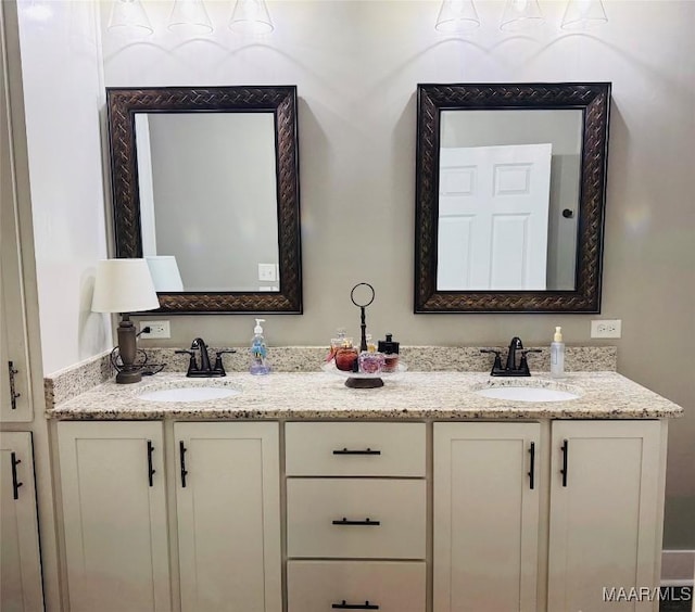 bathroom with double vanity and a sink