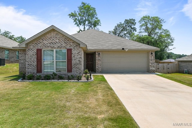 single story home with concrete driveway, an attached garage, a front lawn, central AC, and brick siding