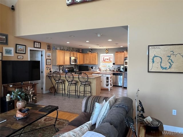 living room with recessed lighting and baseboards