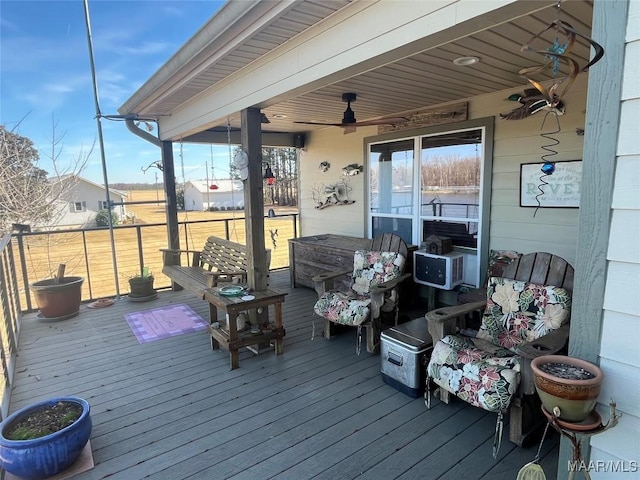 wooden deck featuring a ceiling fan