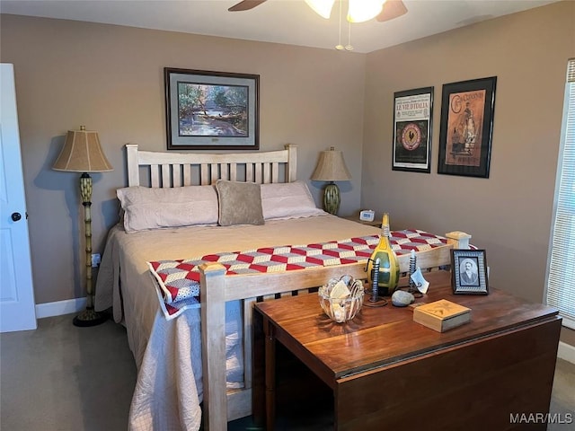 bedroom with ceiling fan, baseboards, and carpet flooring