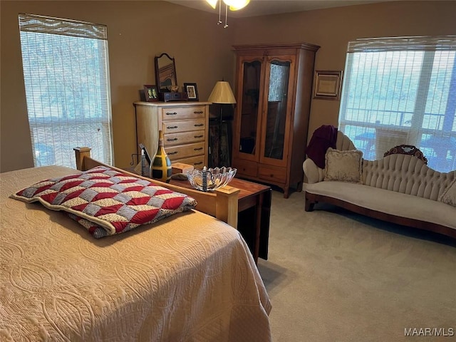 bedroom featuring light colored carpet