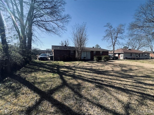 exterior space featuring a front lawn