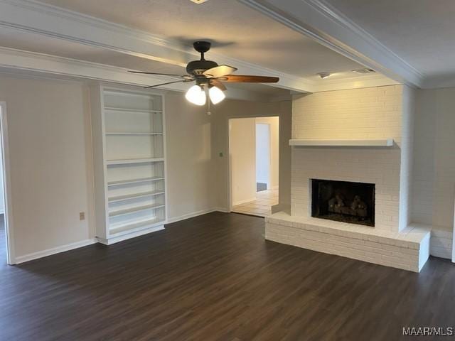 unfurnished living room with ornamental molding, a fireplace, baseboards, and wood finished floors