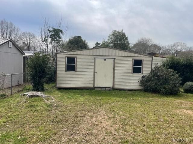 view of shed with fence