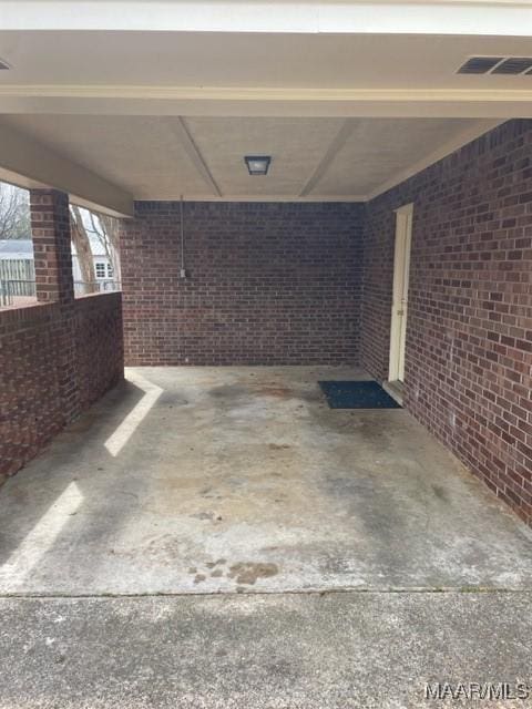 exterior space featuring visible vents and a carport