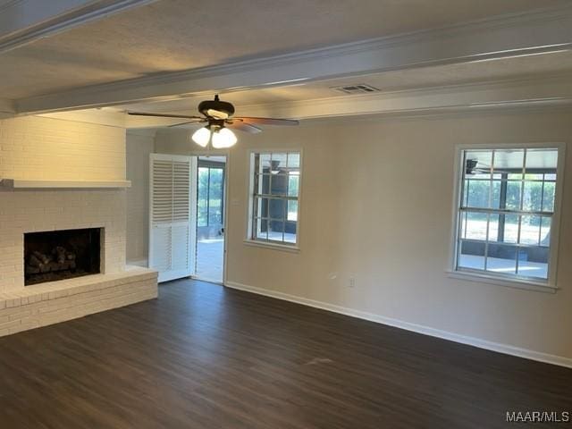 unfurnished living room featuring a fireplace, baseboards, dark wood-type flooring, and beamed ceiling