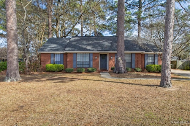 single story home with brick siding and a front lawn