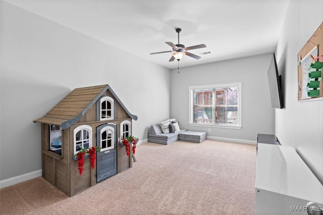 game room with carpet, visible vents, ceiling fan, and baseboards