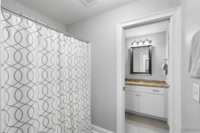 full bathroom with visible vents, vanity, and tile patterned floors