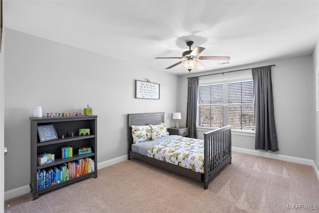 carpeted bedroom with a ceiling fan, visible vents, and baseboards