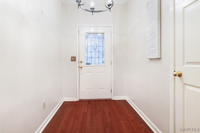 entryway featuring dark wood-style floors, a notable chandelier, and baseboards