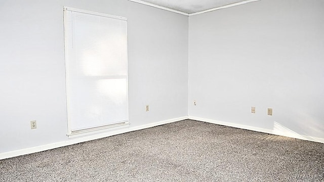 empty room featuring baseboards