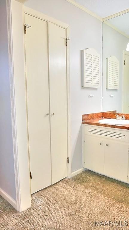 bathroom with vanity and baseboards