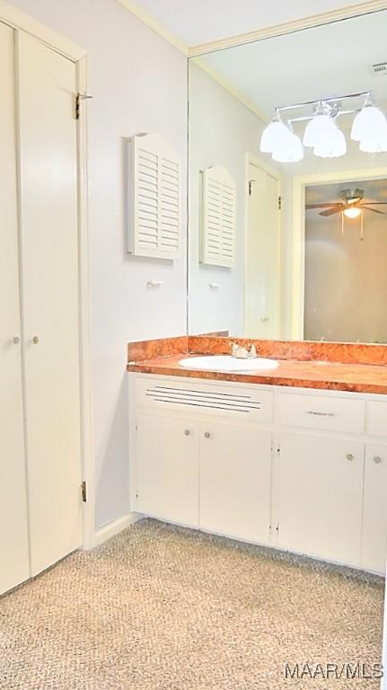 bathroom with ceiling fan and vanity