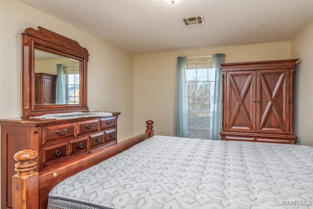 bedroom featuring visible vents