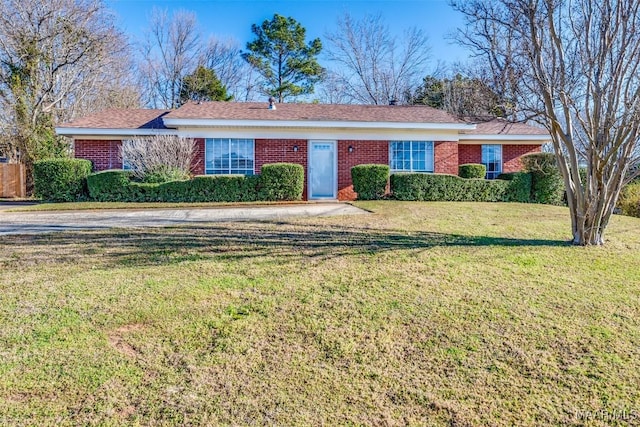 ranch-style home with brick siding and a front yard