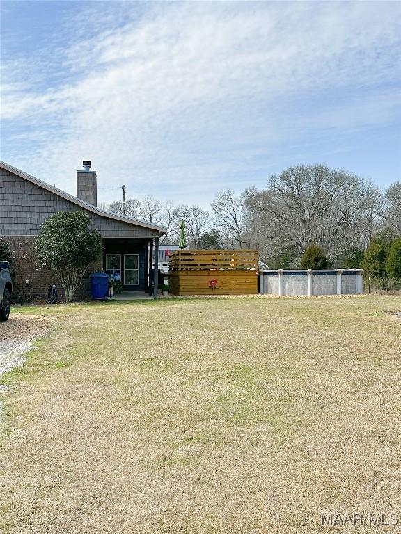 view of yard with an outdoor pool