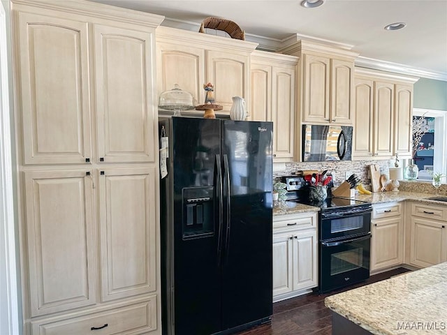 kitchen featuring ornamental molding, dark wood-style flooring, light stone countertops, black appliances, and backsplash