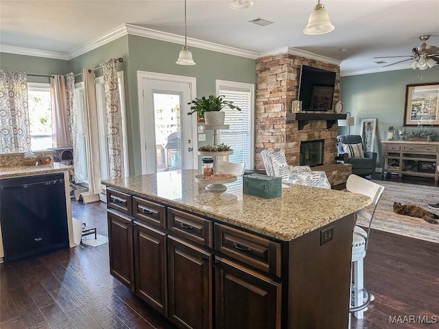 kitchen with dark wood-style floors, a fireplace, visible vents, open floor plan, and dishwasher