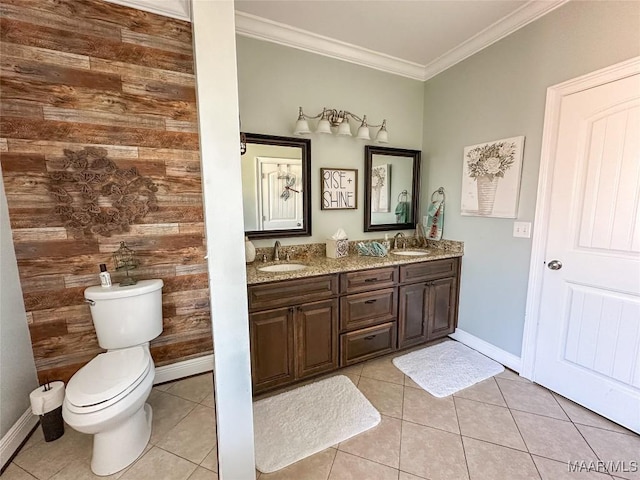 bathroom featuring crown molding, tile patterned flooring, a sink, and toilet