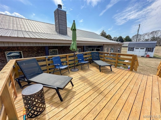 wooden deck with an outdoor structure