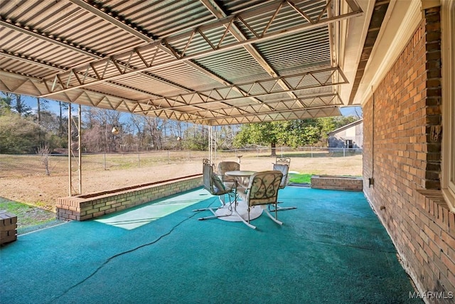 view of patio featuring fence