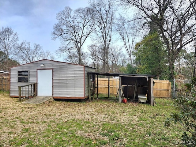 view of shed featuring fence