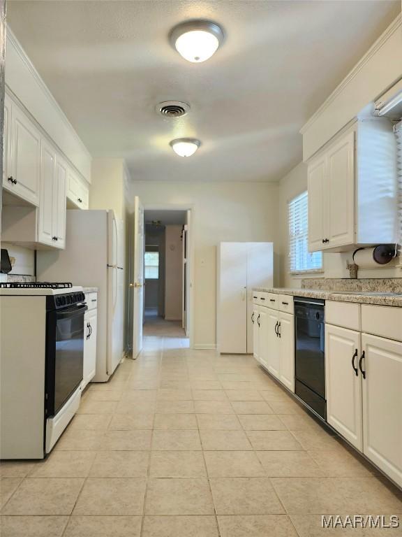 kitchen with visible vents, white cabinets, light countertops, dishwasher, and range with gas cooktop